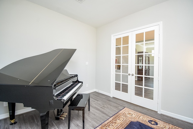 living area featuring hardwood / wood-style floors and french doors