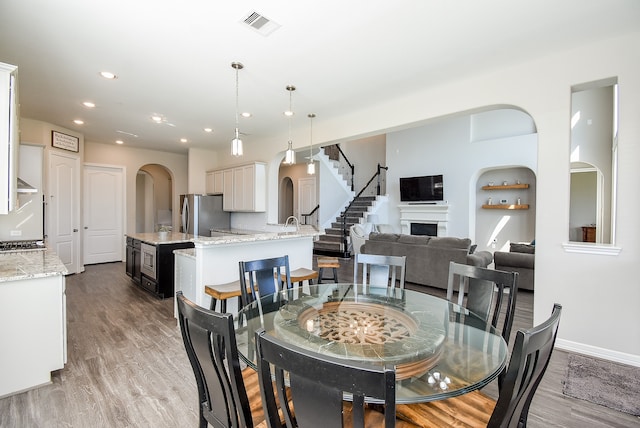 dining space with light hardwood / wood-style floors