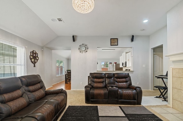 carpeted living room featuring lofted ceiling