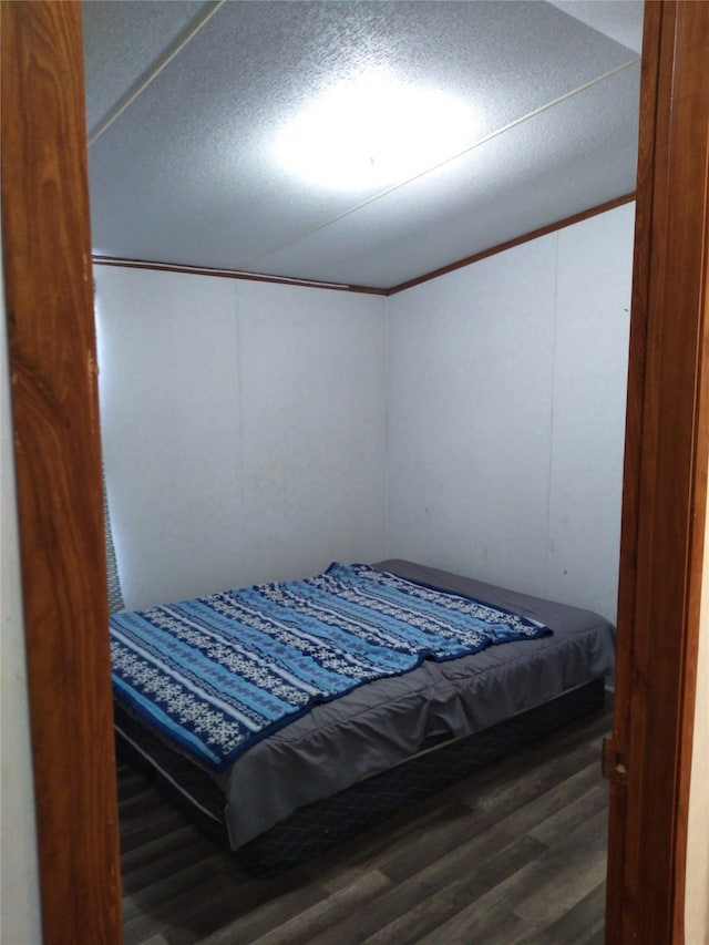 bedroom featuring dark wood-type flooring