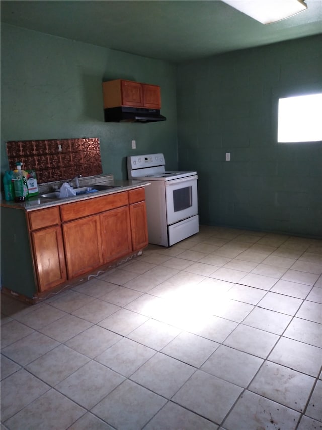 kitchen featuring white range with electric stovetop and sink