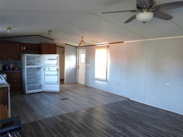 kitchen with dark hardwood / wood-style floors, ceiling fan, and lofted ceiling