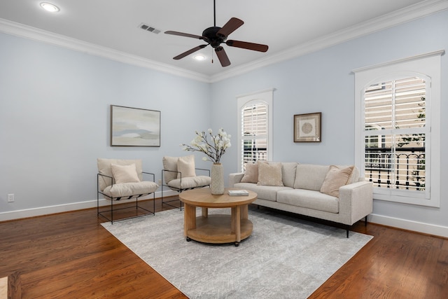 living room with ceiling fan, dark hardwood / wood-style floors, and ornamental molding