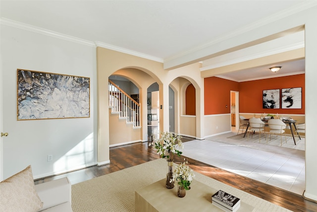 interior space with dark hardwood / wood-style flooring and ornamental molding