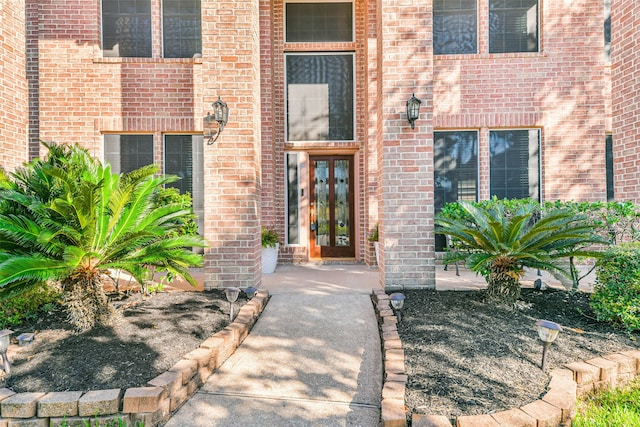 view of exterior entry featuring french doors