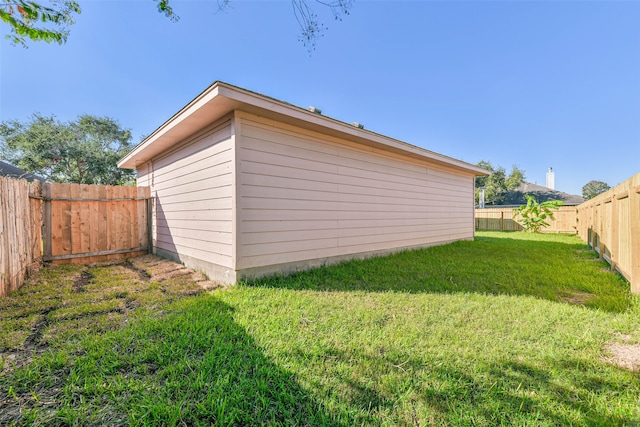 garage featuring a yard