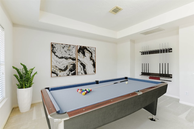 recreation room with a raised ceiling and pool table