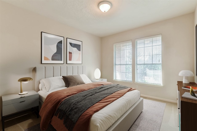 bedroom featuring light colored carpet