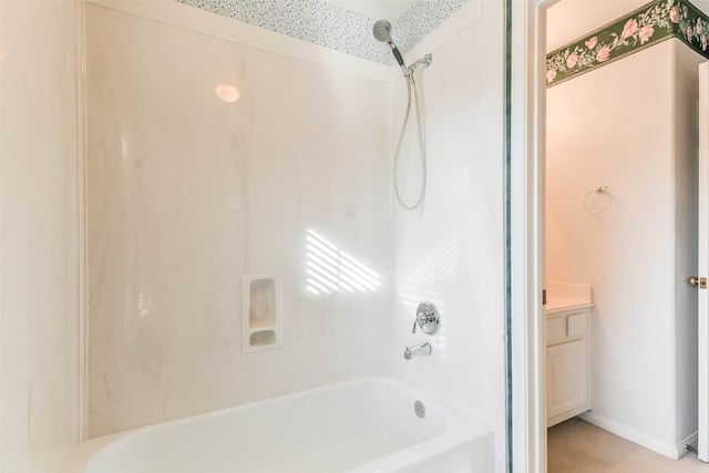 bathroom featuring shower / tub combination and vanity