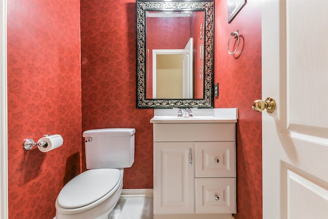 bathroom with vanity and toilet