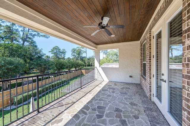 view of patio / terrace featuring ceiling fan, a balcony, and french doors