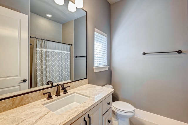 bathroom featuring tile patterned floors, vanity, a shower with shower curtain, and toilet