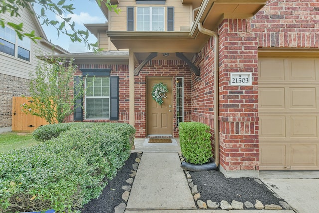 view of exterior entry with a garage