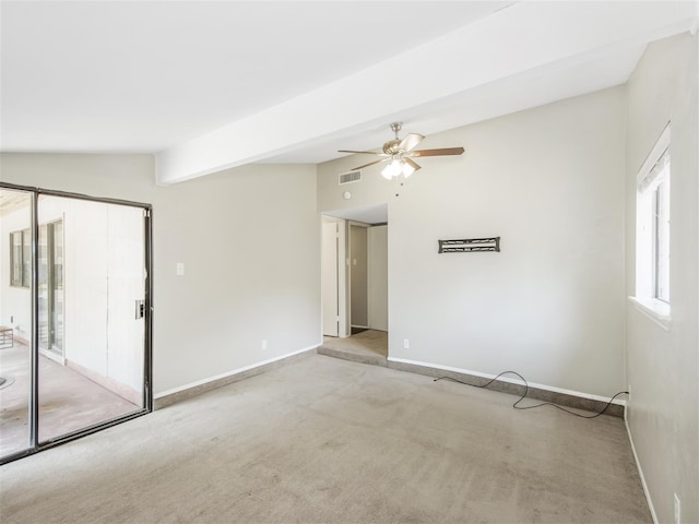 carpeted empty room with vaulted ceiling with beams and ceiling fan