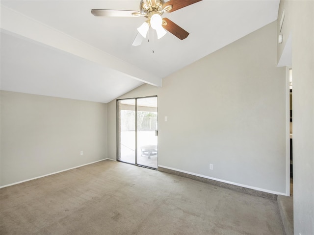 empty room featuring vaulted ceiling with beams, carpet floors, and ceiling fan