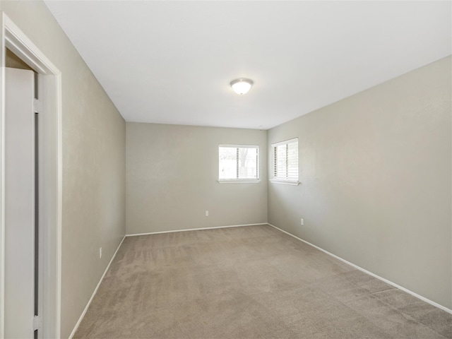 empty room featuring light colored carpet