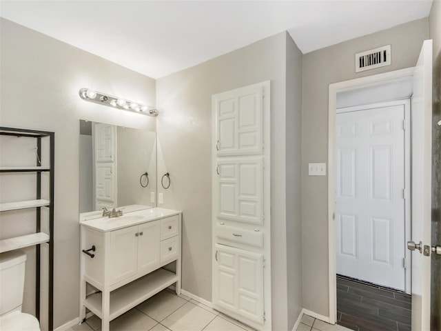 bathroom with hardwood / wood-style floors and vanity