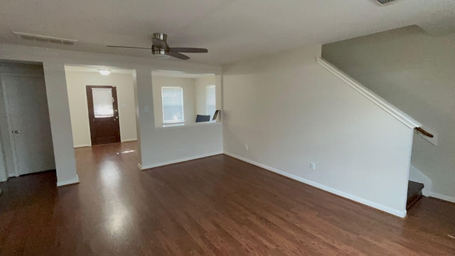 unfurnished living room with ceiling fan and dark hardwood / wood-style flooring