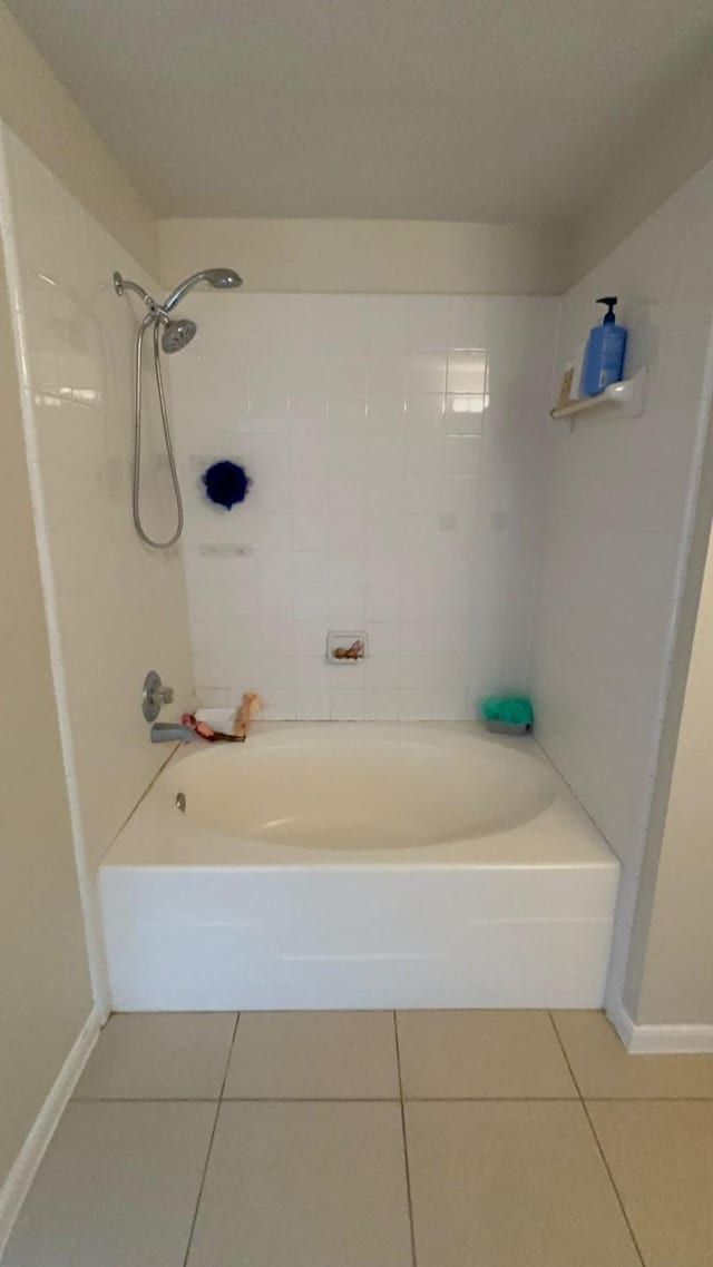 bathroom featuring tile patterned flooring and shower / bathing tub combination