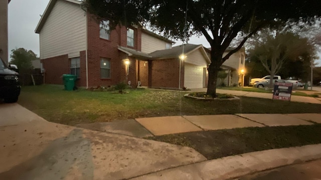 view of front property with a garage and a front lawn