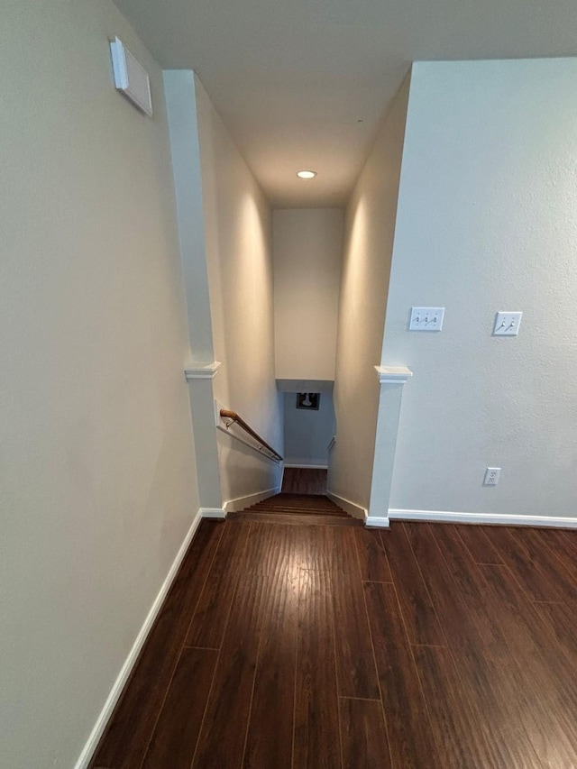 hallway featuring dark wood-type flooring