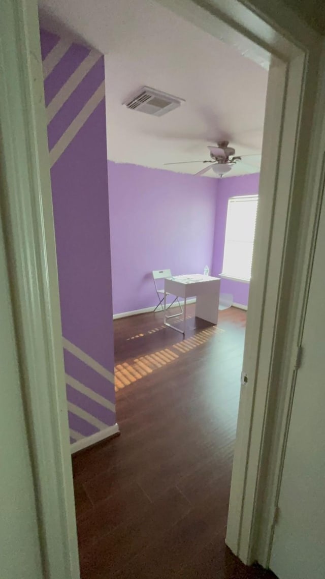 hallway featuring dark hardwood / wood-style flooring