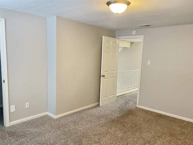 spare room with carpet flooring