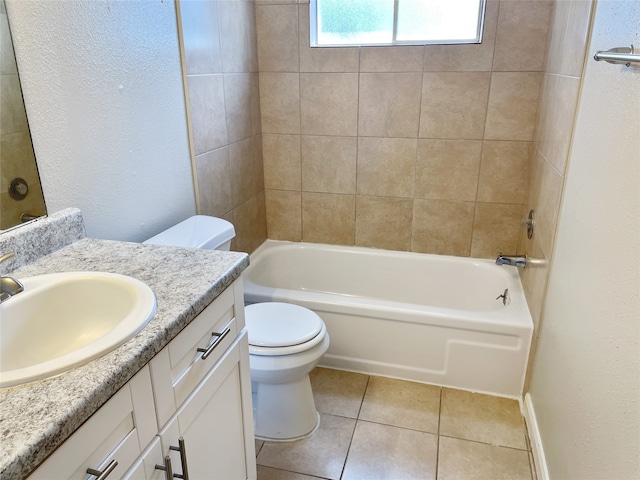 full bathroom with tile patterned floors, vanity, toilet, and tiled shower / bath combo