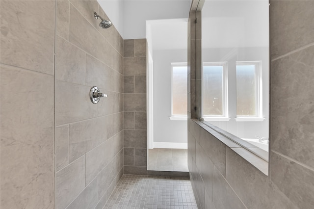 bathroom featuring a tile shower and tile patterned floors