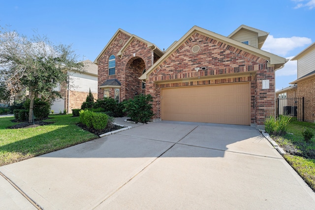 front of property featuring a front yard and a garage