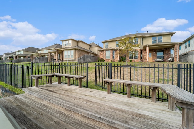 wooden terrace with a lawn