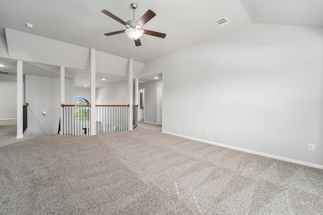 empty room featuring carpet flooring, ceiling fan, and lofted ceiling