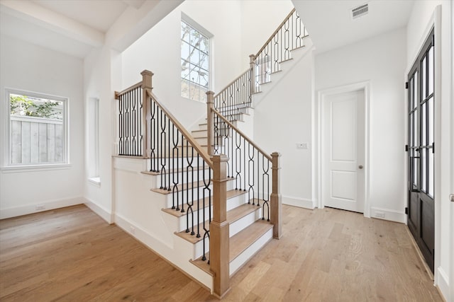 stairway featuring hardwood / wood-style flooring