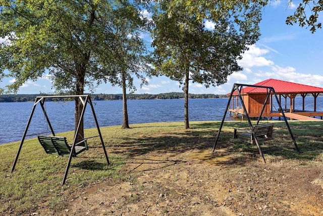 exterior space with a water view and a yard