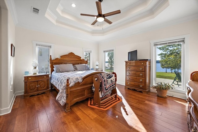 bedroom featuring ceiling fan, dark hardwood / wood-style flooring, and ornamental molding