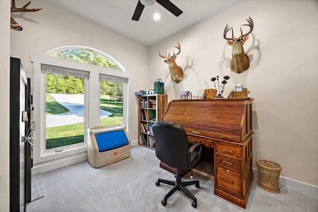 home office with ceiling fan, light colored carpet, and lofted ceiling