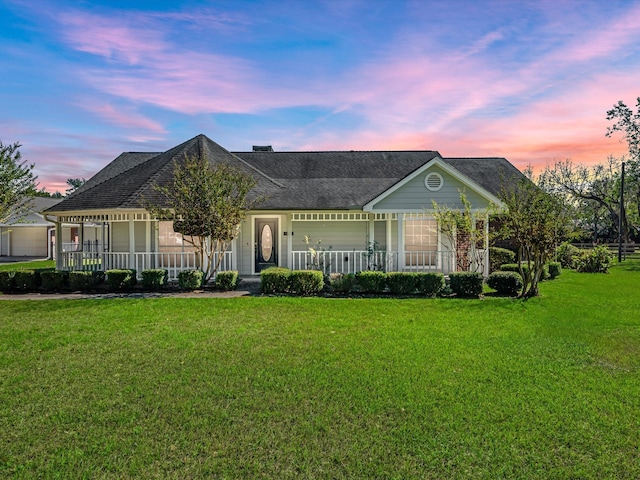 ranch-style home with a yard