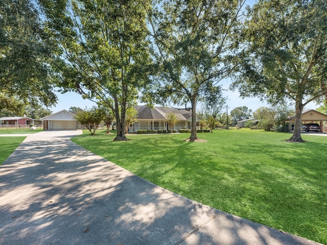 view of front of property featuring a garage and a front lawn