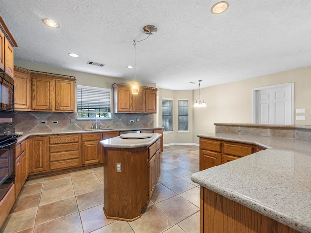 kitchen featuring backsplash, a kitchen island, light tile patterned floors, and hanging light fixtures