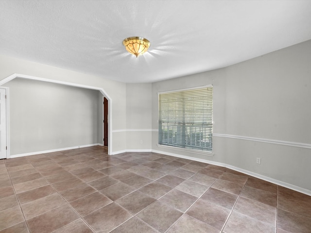 spare room featuring tile patterned floors