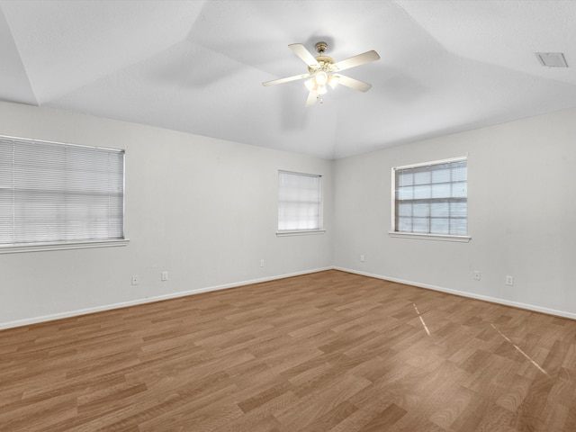 unfurnished room featuring light hardwood / wood-style floors, ceiling fan, and lofted ceiling