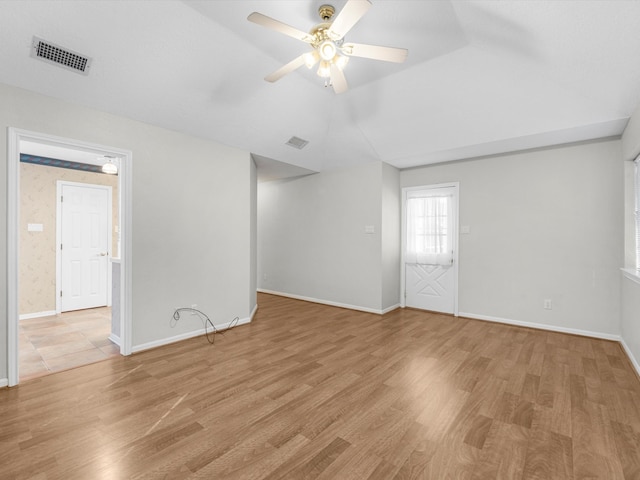 spare room featuring ceiling fan and light hardwood / wood-style flooring