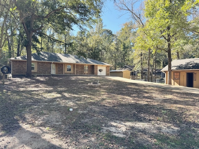 view of front of home with a storage unit