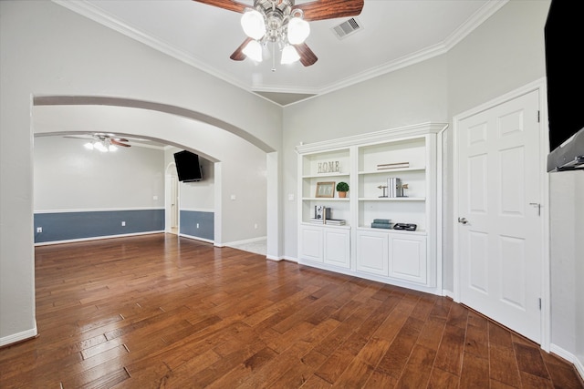 empty room featuring hardwood / wood-style floors, ceiling fan, and crown molding