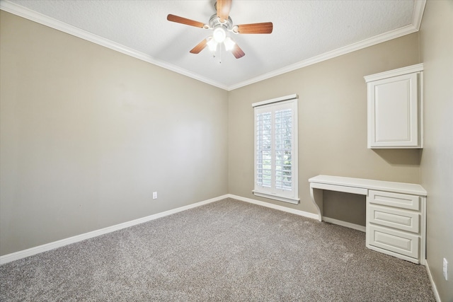 unfurnished office featuring carpet flooring, crown molding, ceiling fan, and a textured ceiling