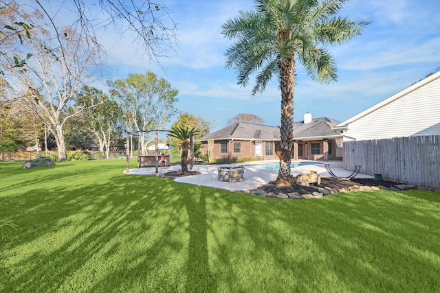 view of yard with a patio and a fenced in pool