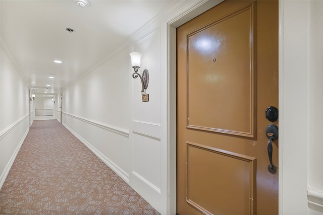 corridor featuring carpet and ornamental molding