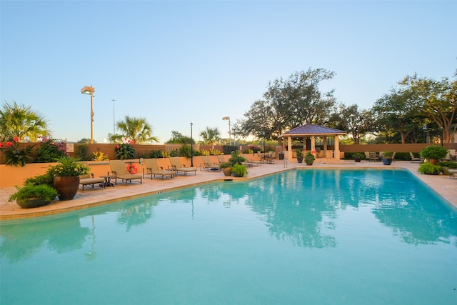 view of pool featuring a gazebo and a patio area