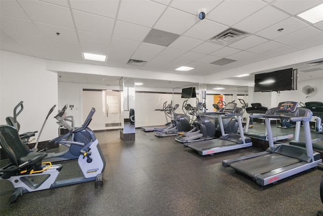 exercise room featuring a paneled ceiling