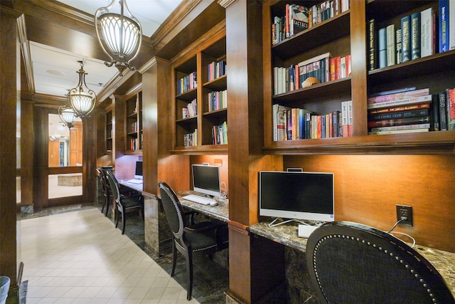 office space featuring built in shelves, crown molding, built in desk, and an inviting chandelier